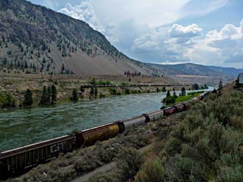 Trains along river