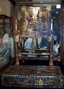 tuts chair * Ceremonial chair of Tutankhamun, with pictures of him and his wife on the back. The foot stand is covered with representations of his enemies, implying that the king has them under his feet. * 312 x 432 * (61KB)