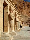 statue row deir el bahir * The row of statues lining the middle terrace of the temple. The guy in black is the tourist police, on guard under his shade stand. * 324 x 432 * (51KB)