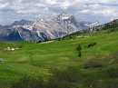 passo di falzarego meadow + mountain * This lush green high meadow was near the Falzarego Pass, with the Dolomites in the background. * 432 x 323 * (59KB)