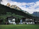 hotel + peaks pozza di fassa * Our hotel (on left) and the mountain peaks behind Poazza de Fassa, a small village in the Dolomites. * 432 x 323 * (50KB)