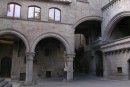 Piazza Pelegrini * Piazza Pelegrini in the medieval quarter of Viterbo, Italy.  All the buildings in the square are made from the same stone and the lovely arches repeat throughout. * 432 x 291 * (43KB)