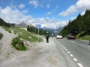 verna taking picture down road * A usual sight with us, Verna walking down the road to get a better picture of the view.  Here at Pass dal Fuorn, we are at 2149 meters (7050 feet).