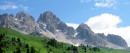 view from passo san pelligrino * View of the mountains and the grassy slopes (used for skiing in the winter) at the Passo San Pellegrino in the Italian Alps.