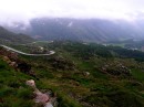 road-down-bernina-pass * View of the road heading down from the Berninapass, Switzerland.  There was no view from the top of the pass bacuase of the low clouds. * 432 x 323 * (63KB)